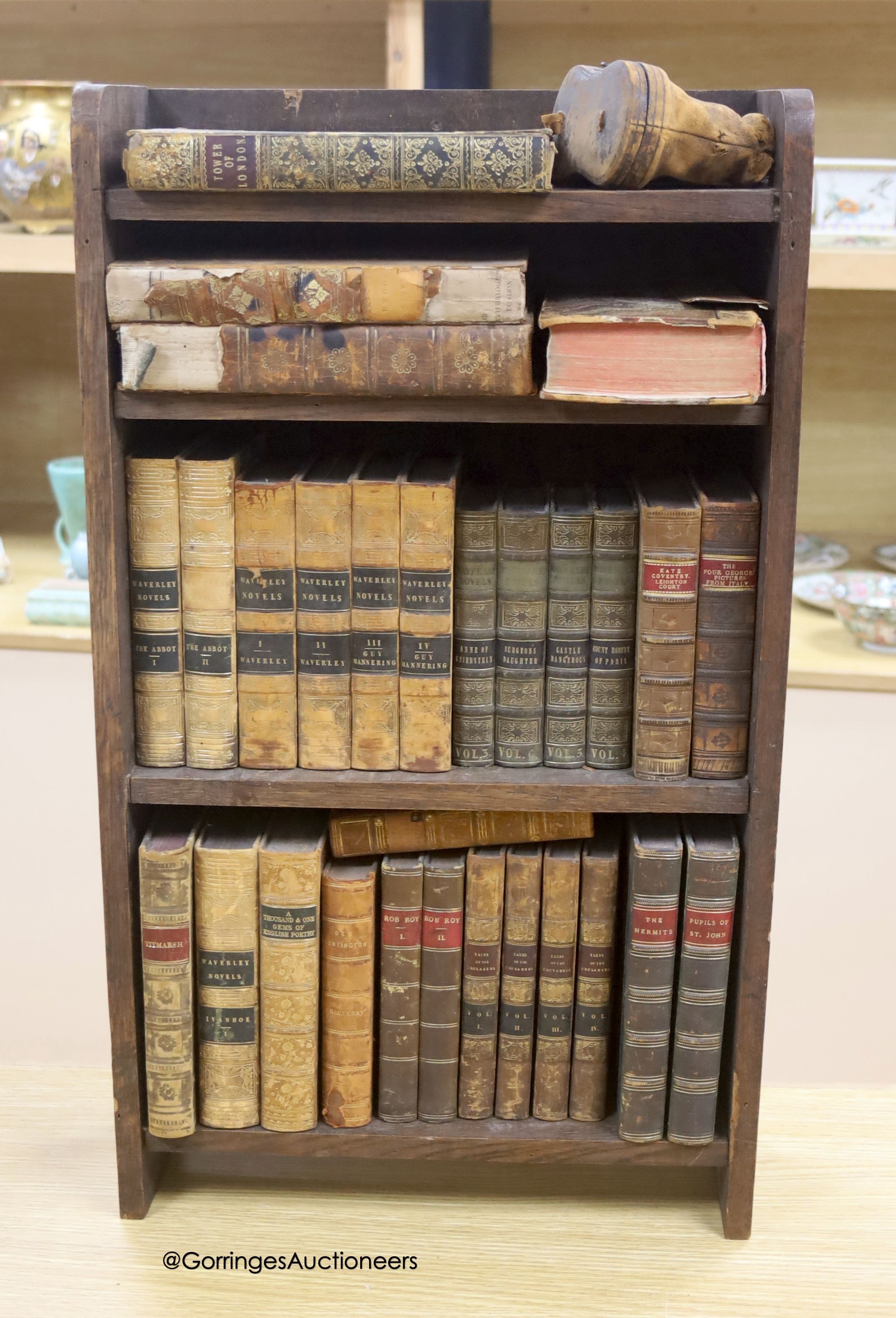 A group of 19th century leather bindings including Waverley Novels, Rob Roy, Tales of The Crusaders, etc., displayed in an oak bookcase, height 66cm